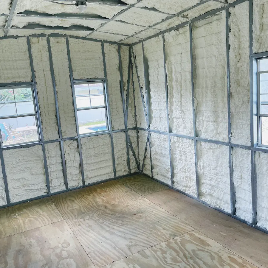 Closed-cell spray foam insulation applied to wall cavities in a residential project in Kent